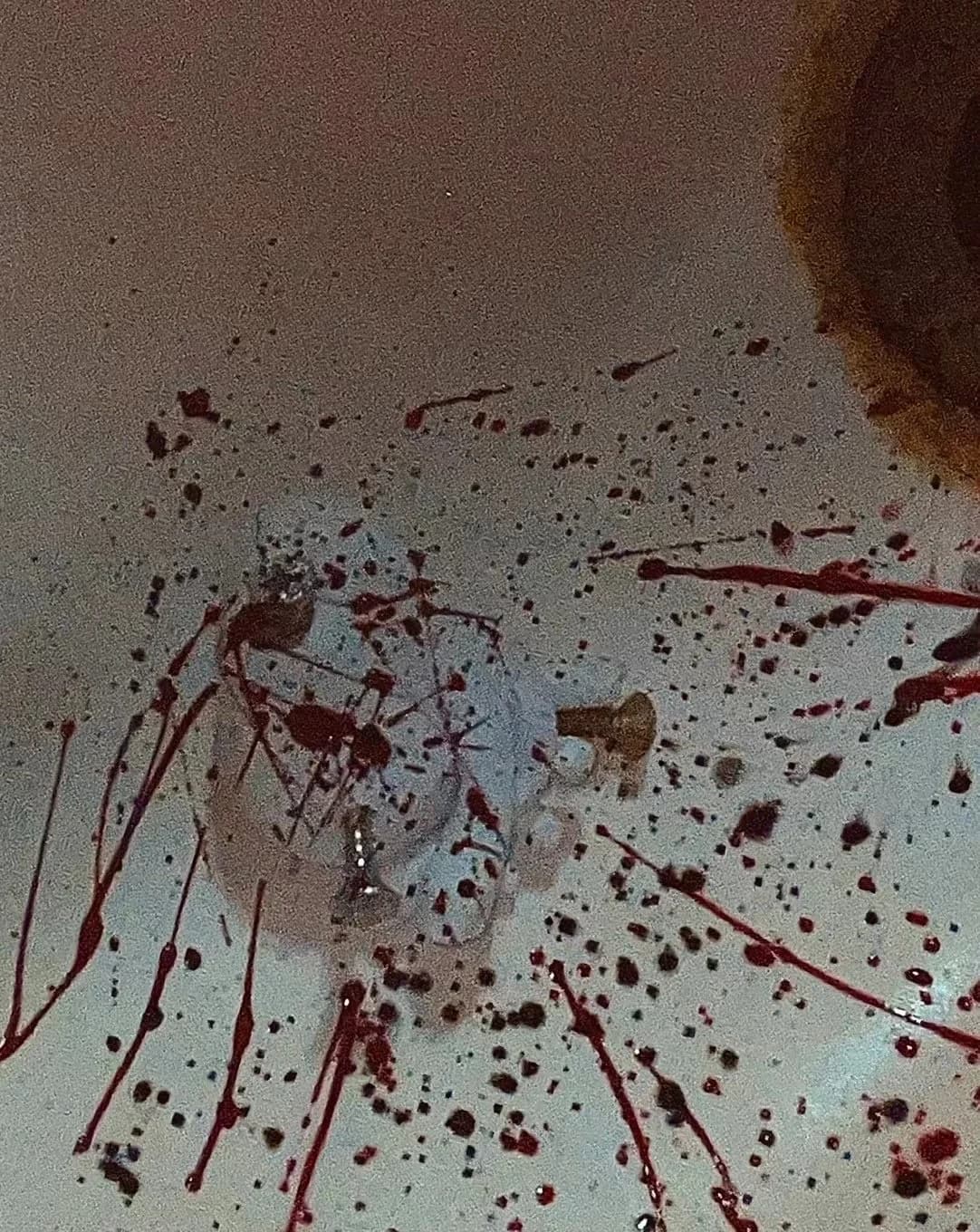 Splatter decoration on a white garment.