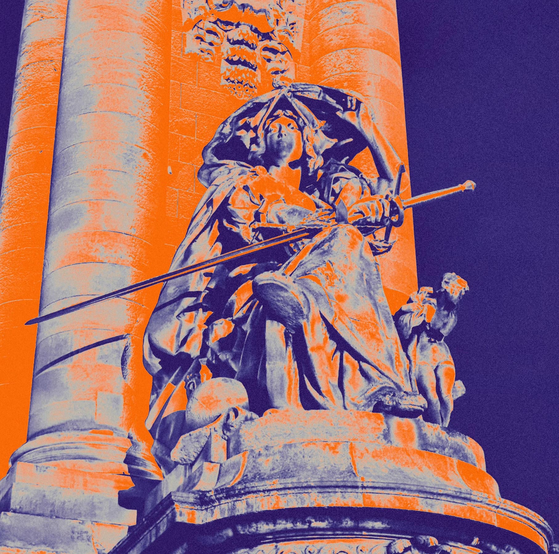 Saturated orange and purple detail of a monument.