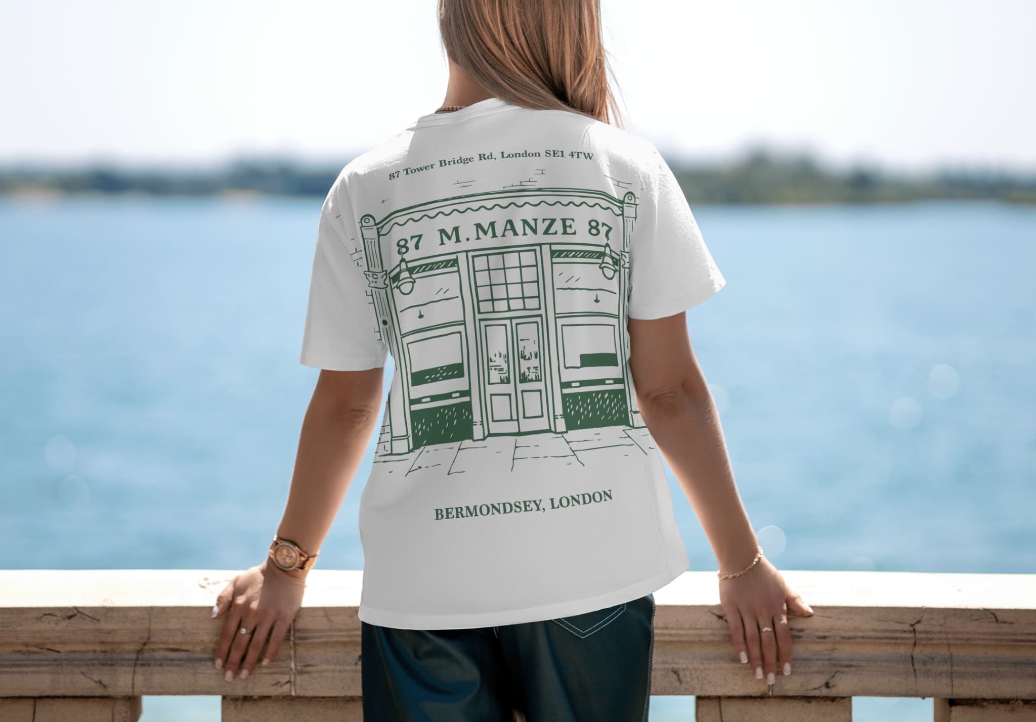 Supplied back T-shirt design presentation with a large green M. Manze shopfront graphic and Bermondsey lettering.